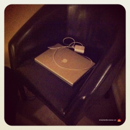 My old Mac PowerBook laptopon our leather chair.